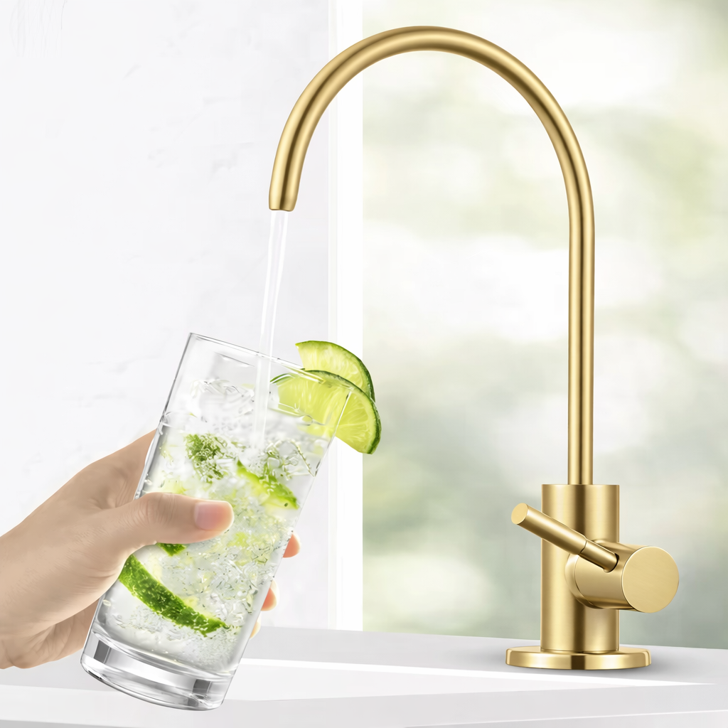 Brushed gold water filter faucet with elegant curved design filling glass with fresh water