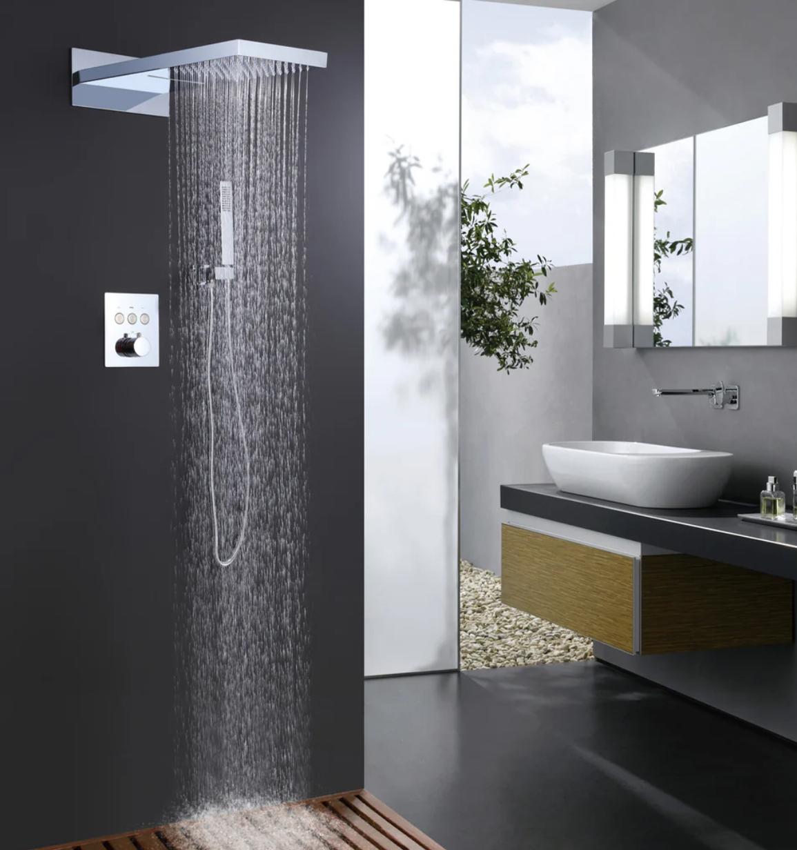 Luxury bathroom featuring MAX Faucets chrome thermostatic shower system with waterfall and rainfall functions
