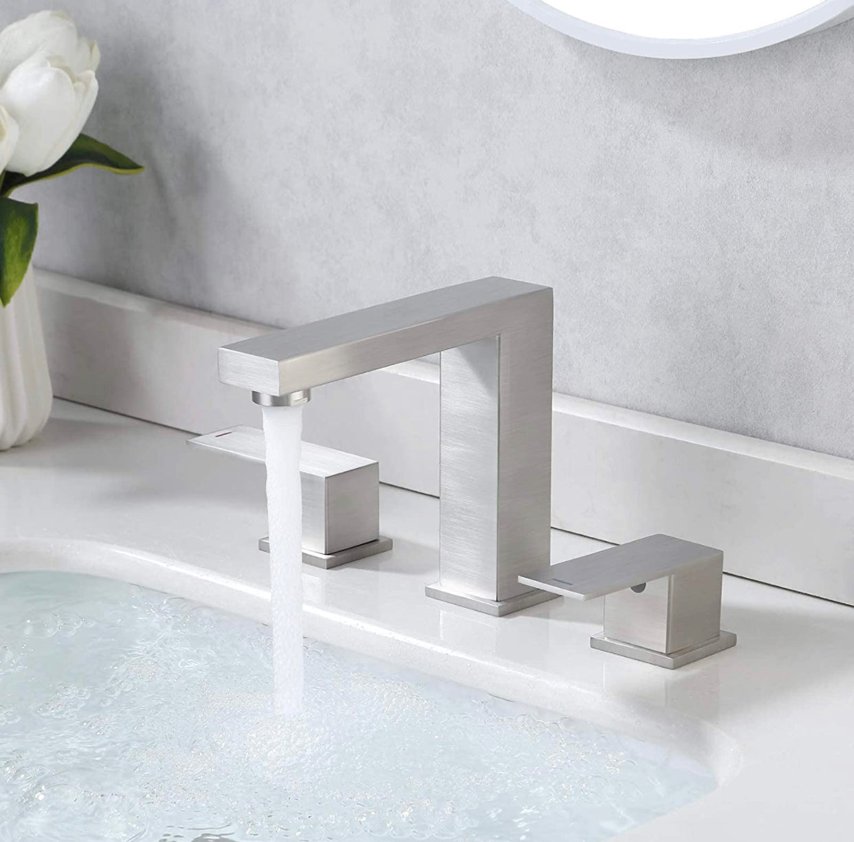 Widespread bathroom sink faucet with dual handles and modern design for luxury vanity setup