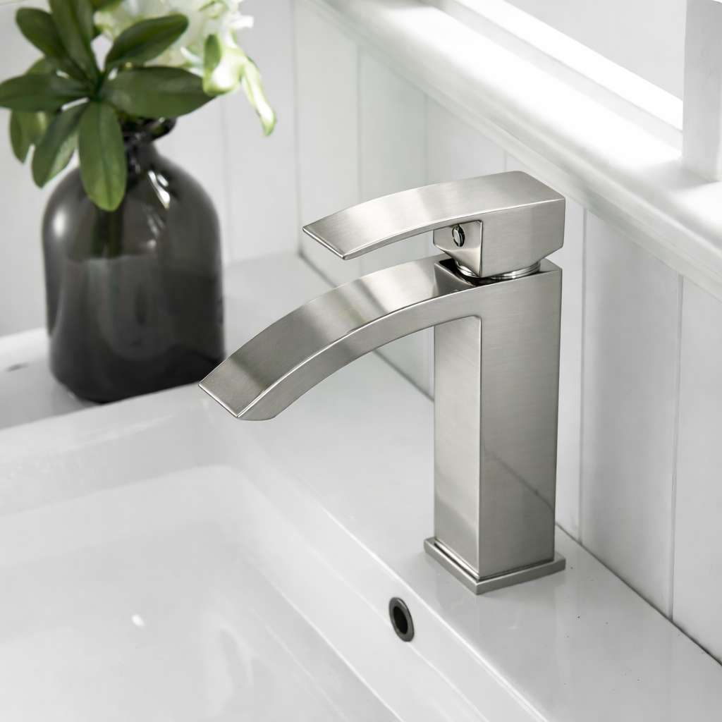 Side view of MAX Faucets brushed nickel waterfall bathroom faucet showing open spout
