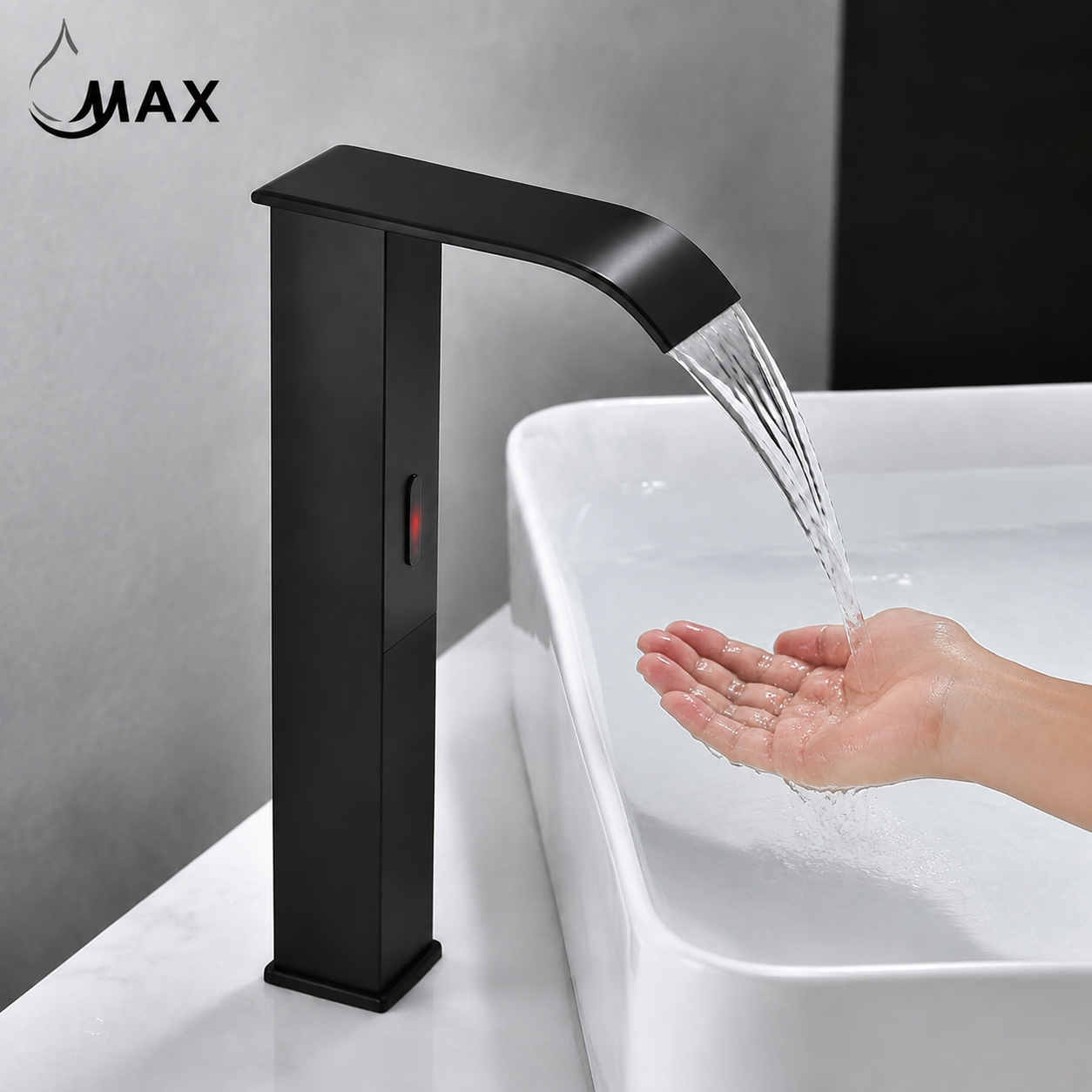 A matte black single-handle bathroom faucet with water flowing from the spout into a white sink, shown with a human hand receiving the water. The brand name 'MAX' is visible in the top left corner.