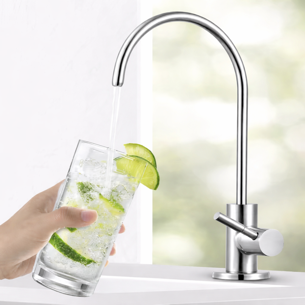 Polished chrome water filter faucet with high arc spout pouring drinking water into glass