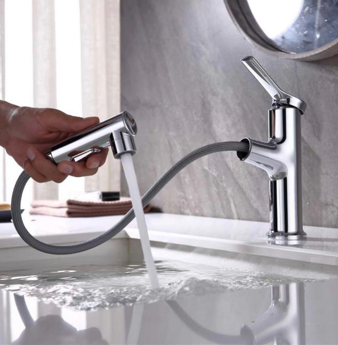 Pull-out bathroom sink faucet with flexible spray head and modern single handle design