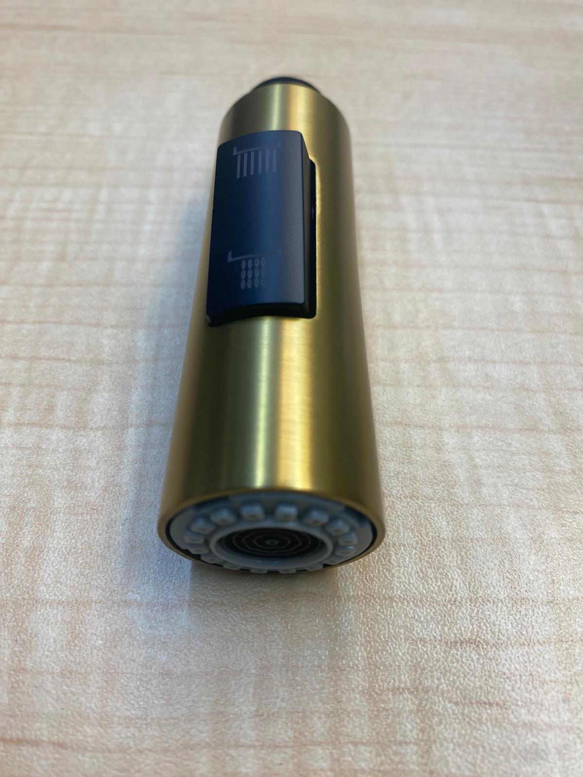 Gold kitchen faucet spray head on a white background