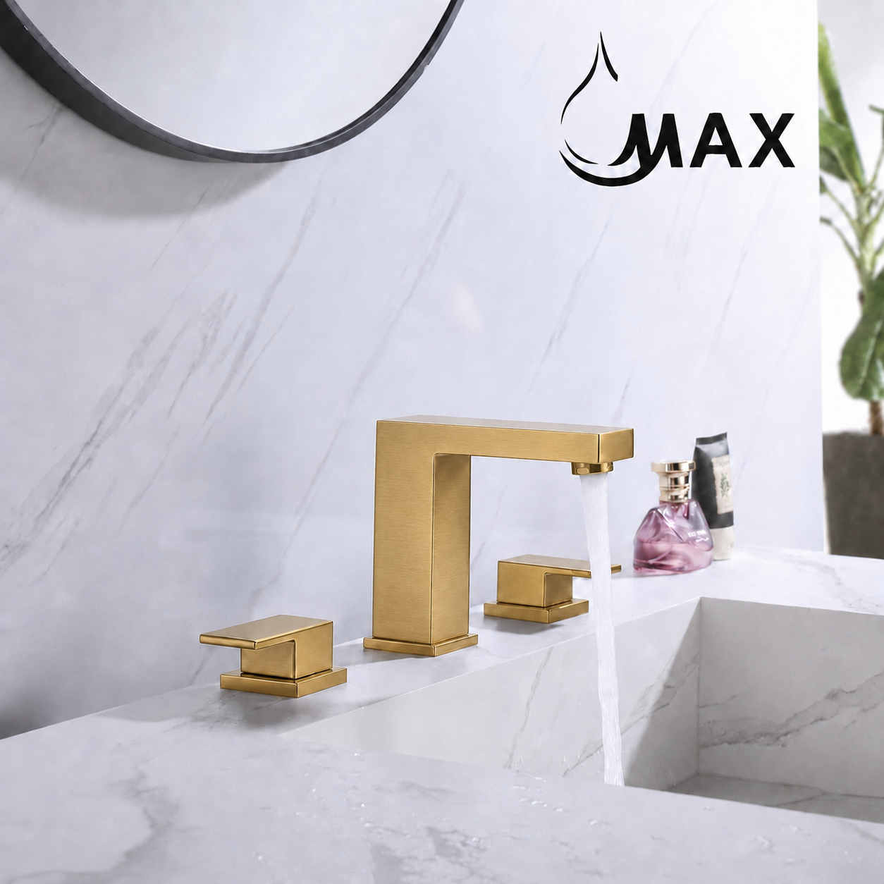A modern matte gold bathroom faucet set with a tall rectangular spout, two matching lever handles, and running water into a white marble sink. A black circular mirror is partially visible on the wall, and the brand logo 'MAX' appears in the upper right corner.