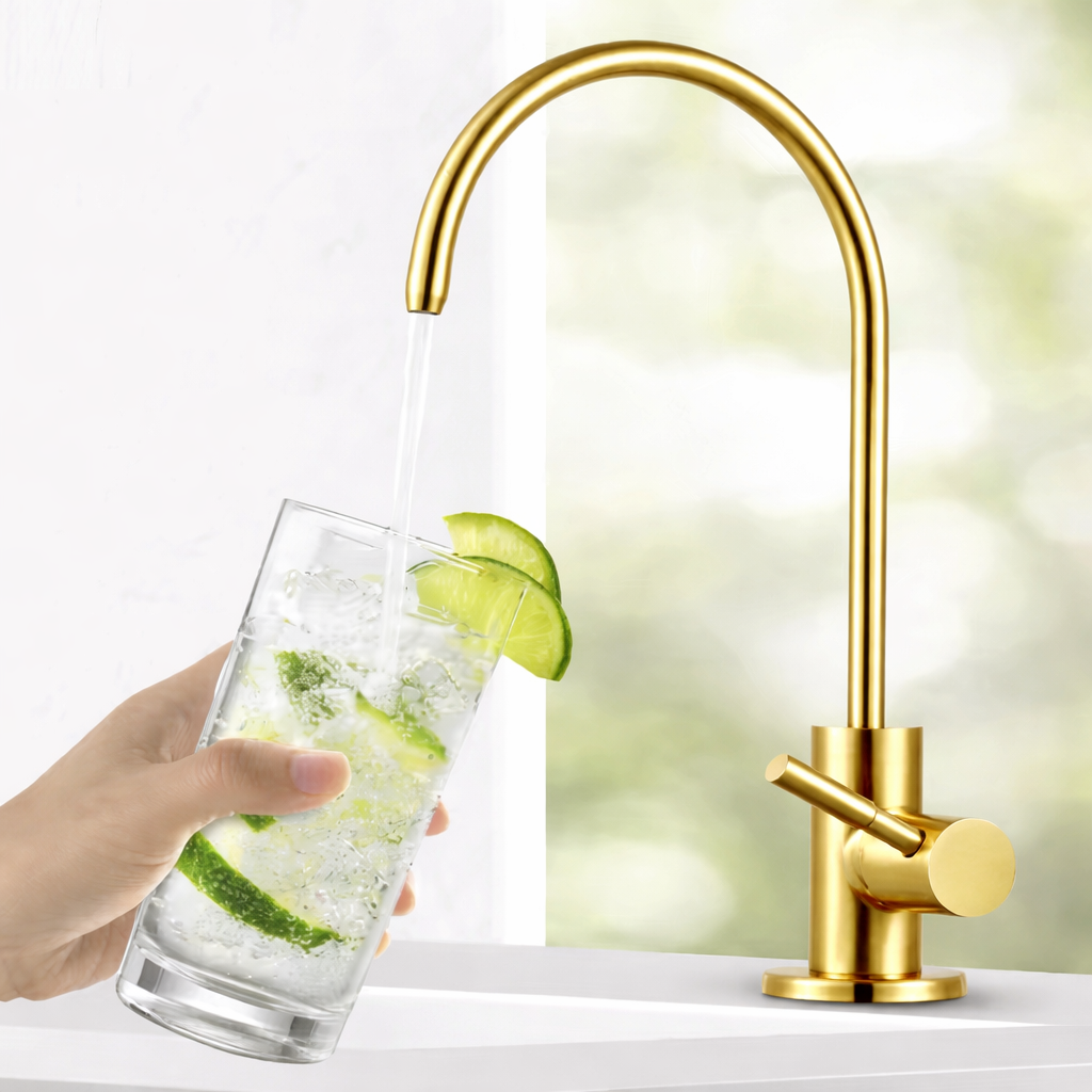 Shiny gold water filter faucet with elegant curved design filling glass with fresh water