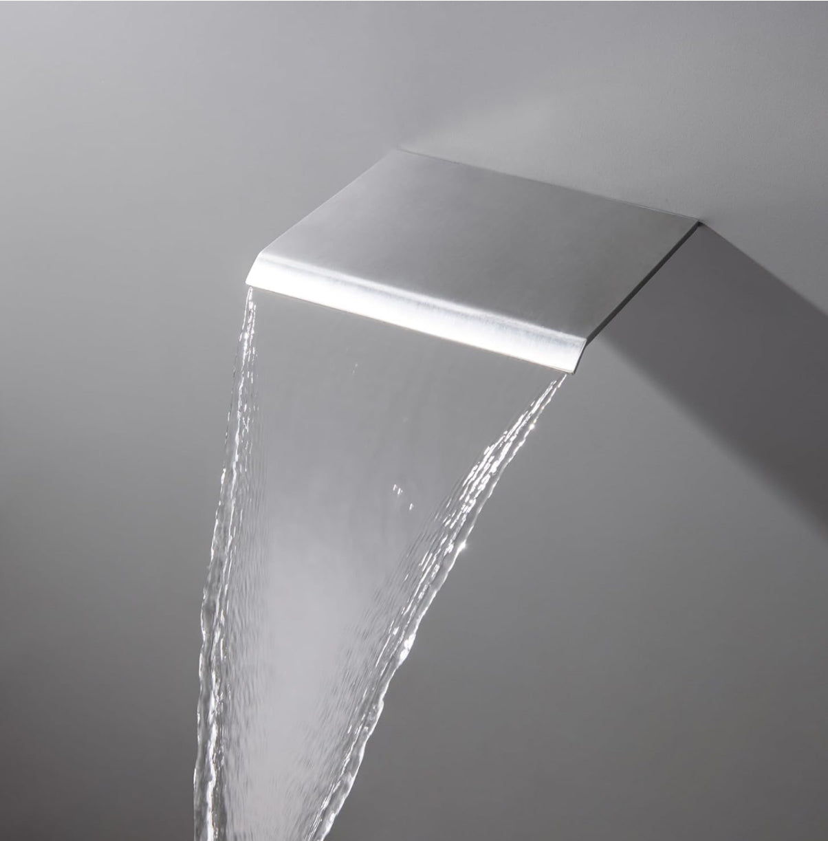Modern shower head with water flow on a gray background