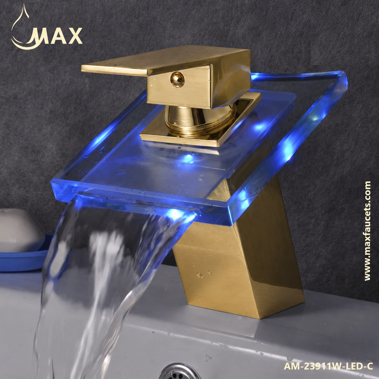 A modern waterfall bathroom faucet with a brushed gold finish and integrated blue LED lighting, shown installed on a sink with water flowing. The brand MAX is visible in the top left corner.