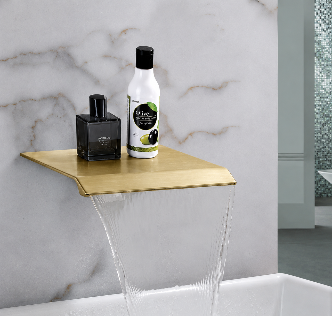 Brushed gold waterfall tub spout with integrated shelf design for bathroom accessories
