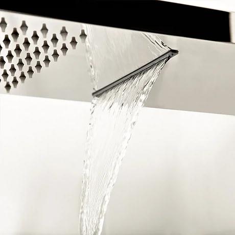 Close-up of brushed nickel finish on modern shower system