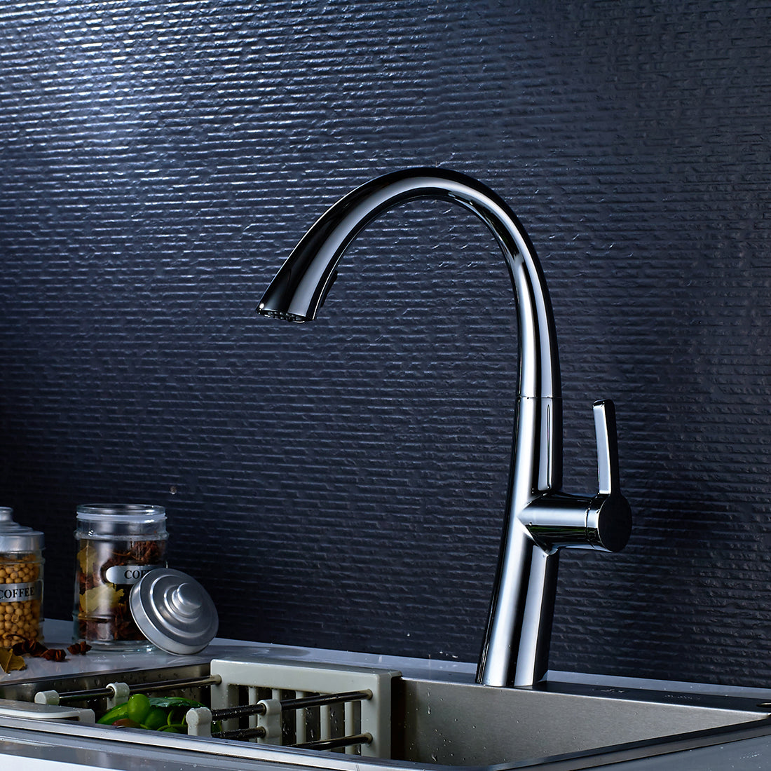Chrome kitchen faucet featuring pull-out sprayer and high-arc spout