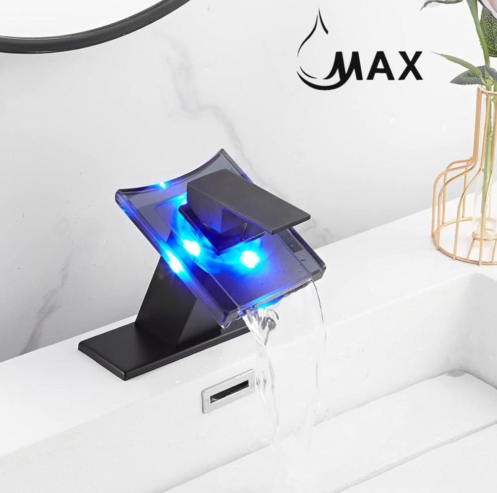 Matte black waterfall faucet displaying a blue water-temperature light