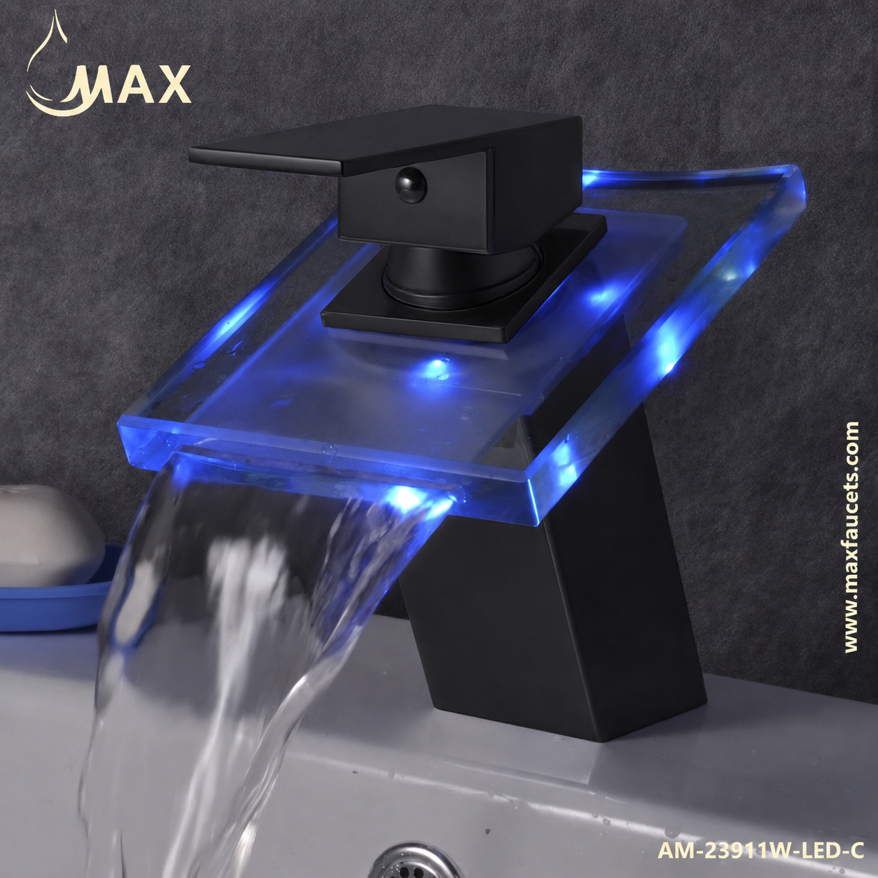 Modern waterfall bathroom faucet with a matte black body, clear acrylic apron-front basin, and built-in blue LED lighting, shown with water flowing over the edge against a dark gray tiled wall.