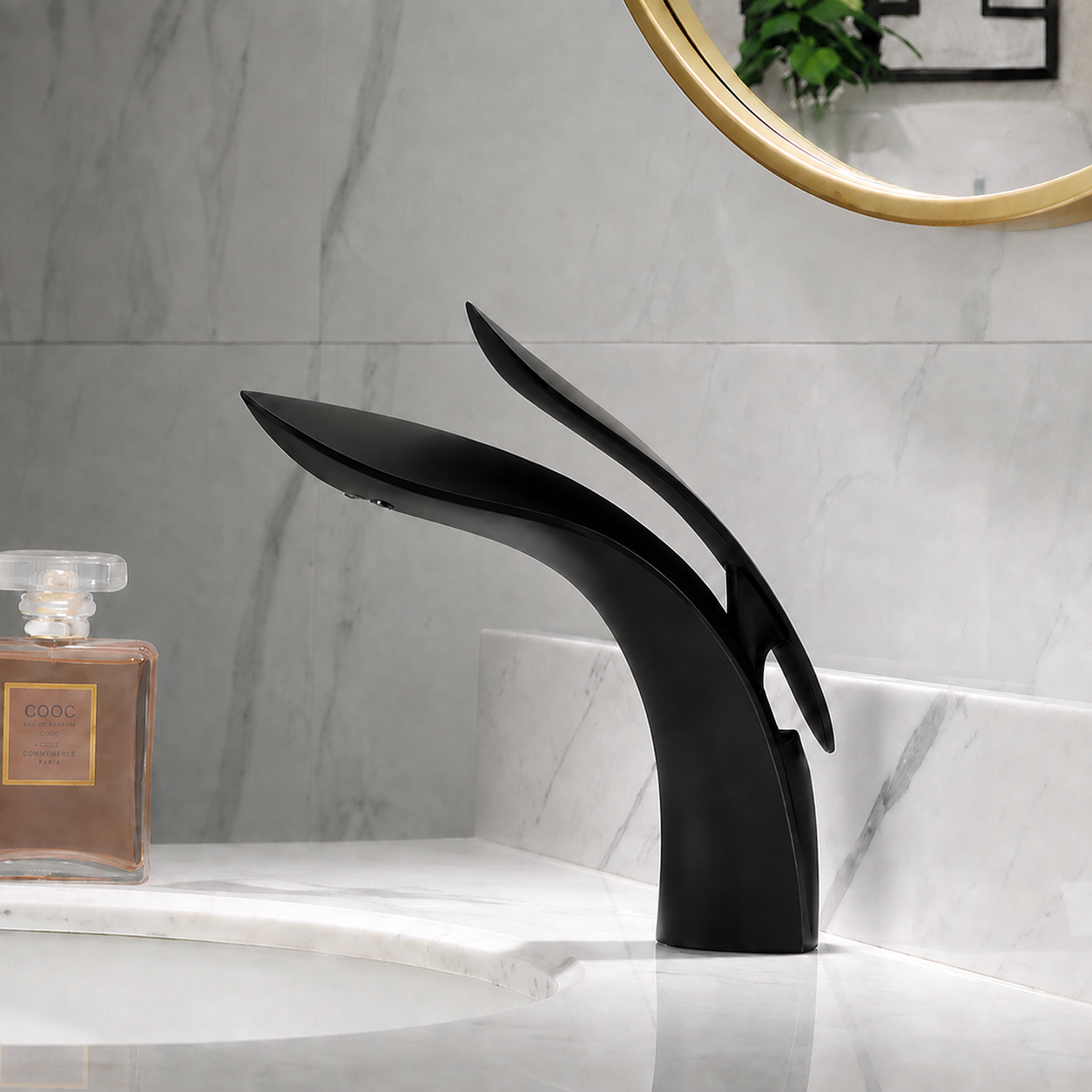 Matte black waterfall bathroom sink faucet installed on a white marble vanity