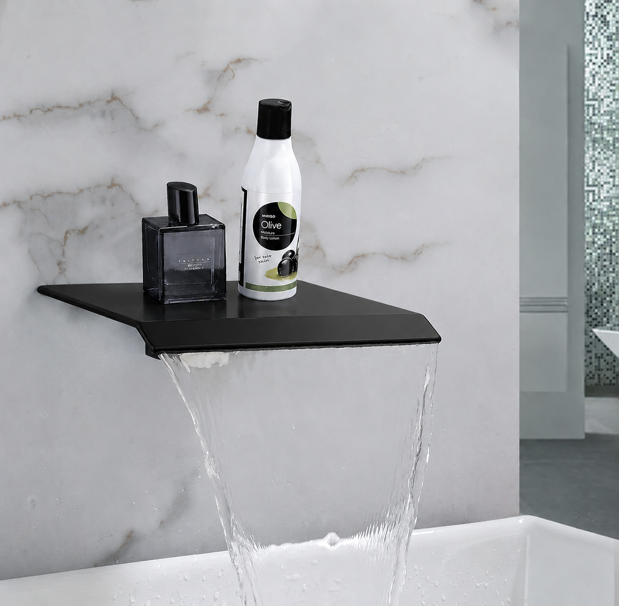 Bathroom setting with a black sink and running water, featuring a bottle and perfume on the sink.