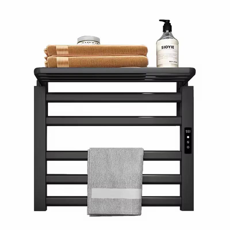 Modern black heated towel rack installed in bathroom wall mounted towel warmer with shelf