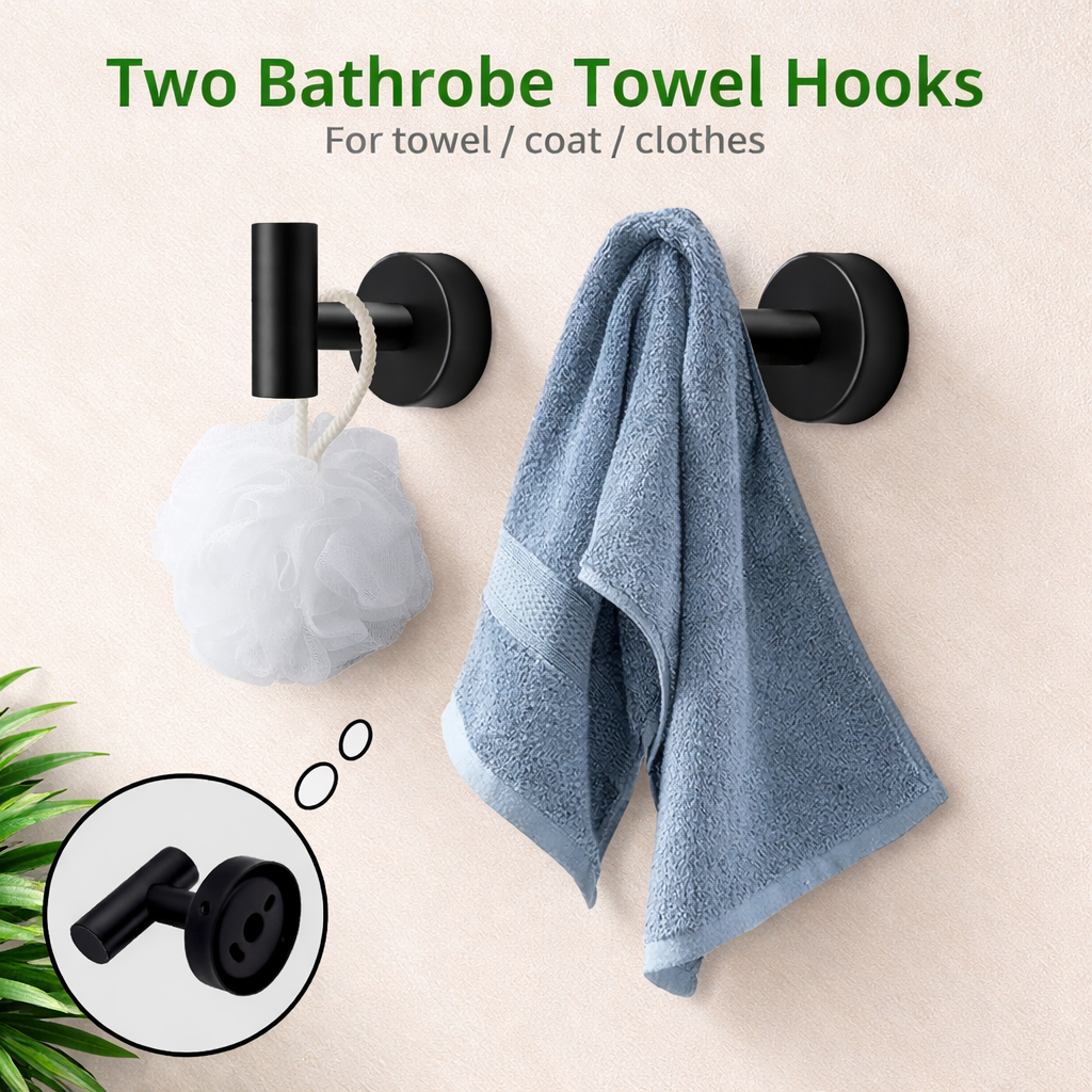 Matte black double robe hooks holding towel and bath sponge on bathroom wall