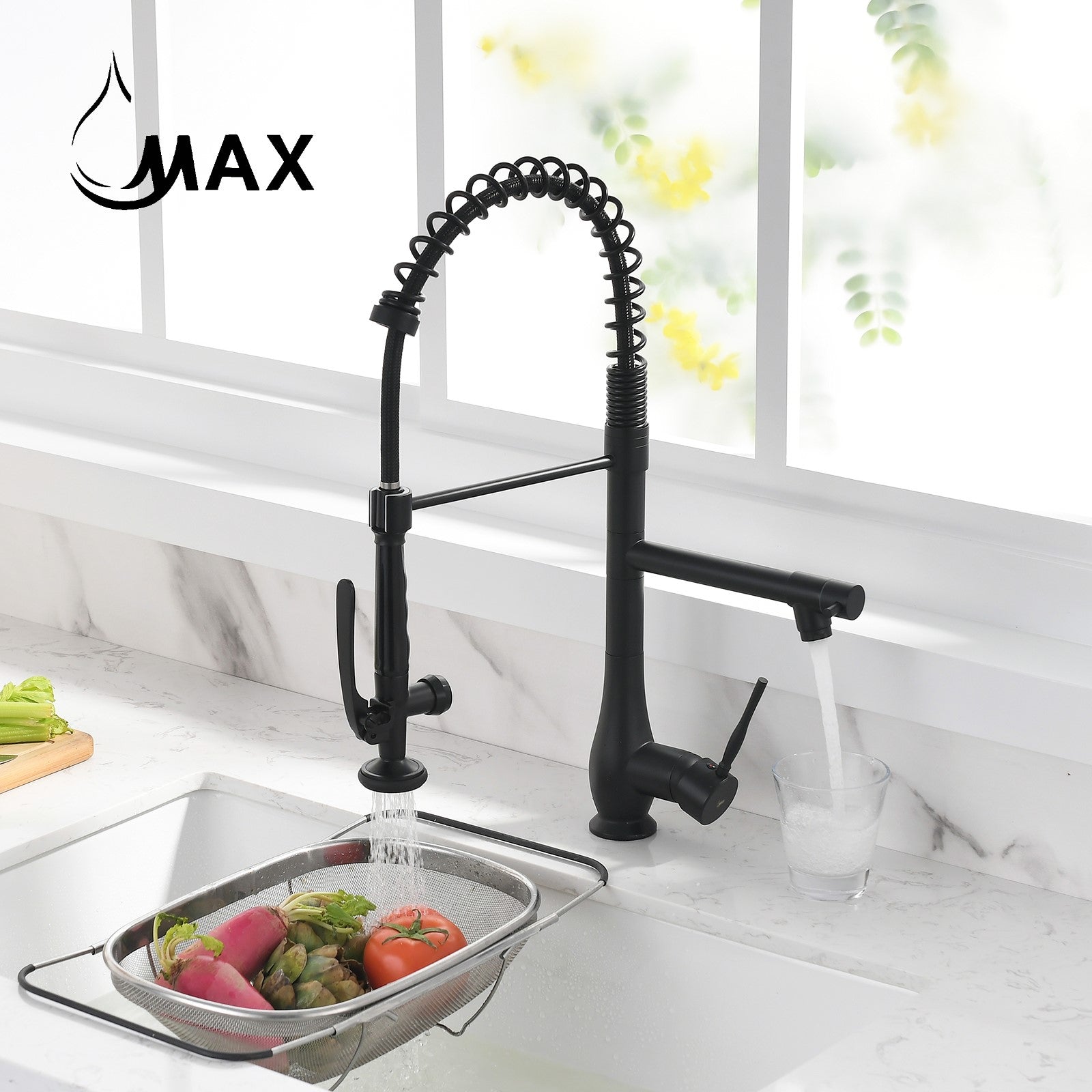 Matte black pre-rinse chef-style kitchen faucet with pull-down sprayer installed over sink