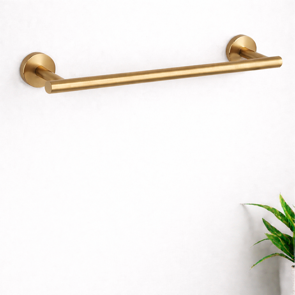 Minimalist brushed gold towel bar mounted on a clean white wall with modern design