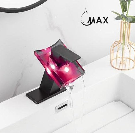 Single-handle matte black bathroom faucet with a glass waterfall spout
