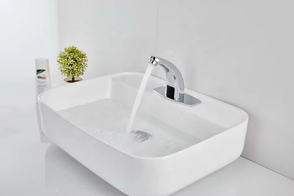 Touchless bathroom faucet installed in a modern bathroom vanity chrome finish