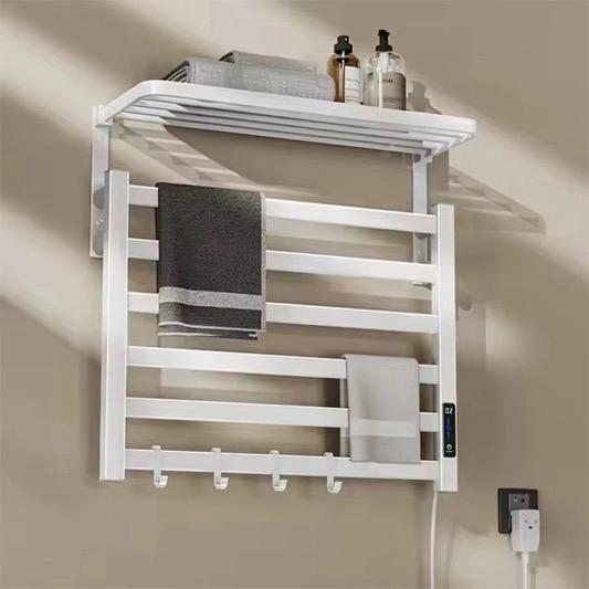 White electric towel warmer rack with towel and shelf modern bathroom