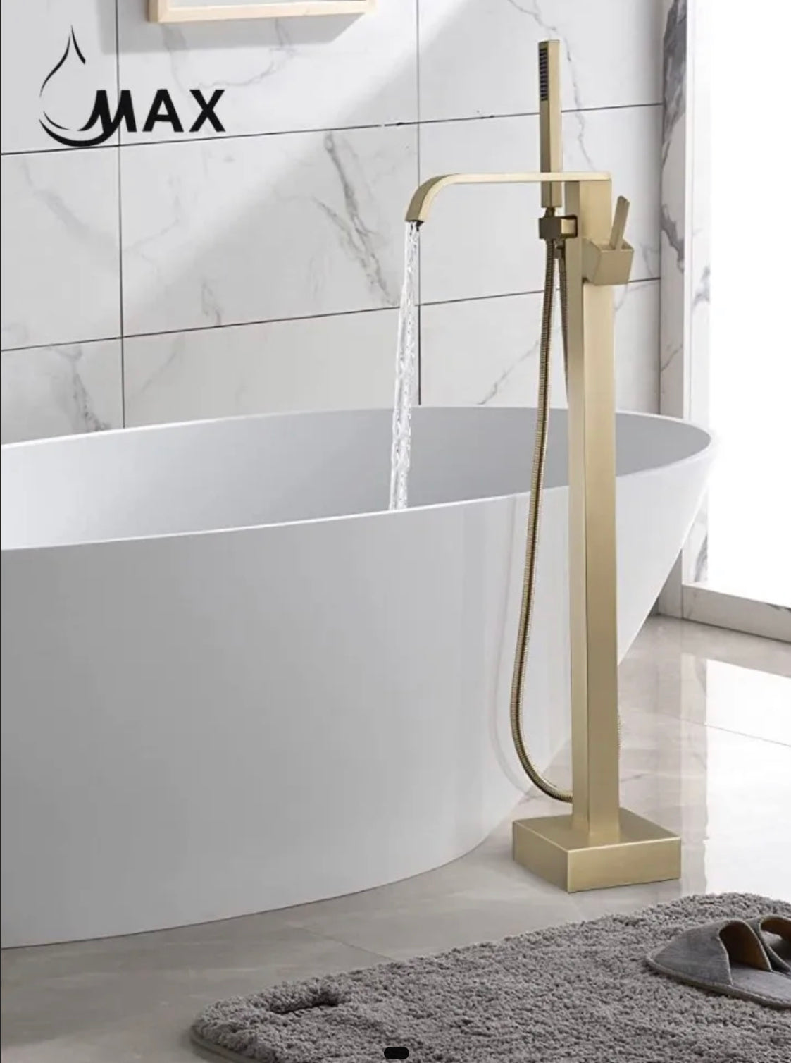 A MAX Faucets waterfall freestanding bathtub faucet with single handle in brushed gold finish, floor-mounted, including a handheld shower, installed in a bathroom setting.