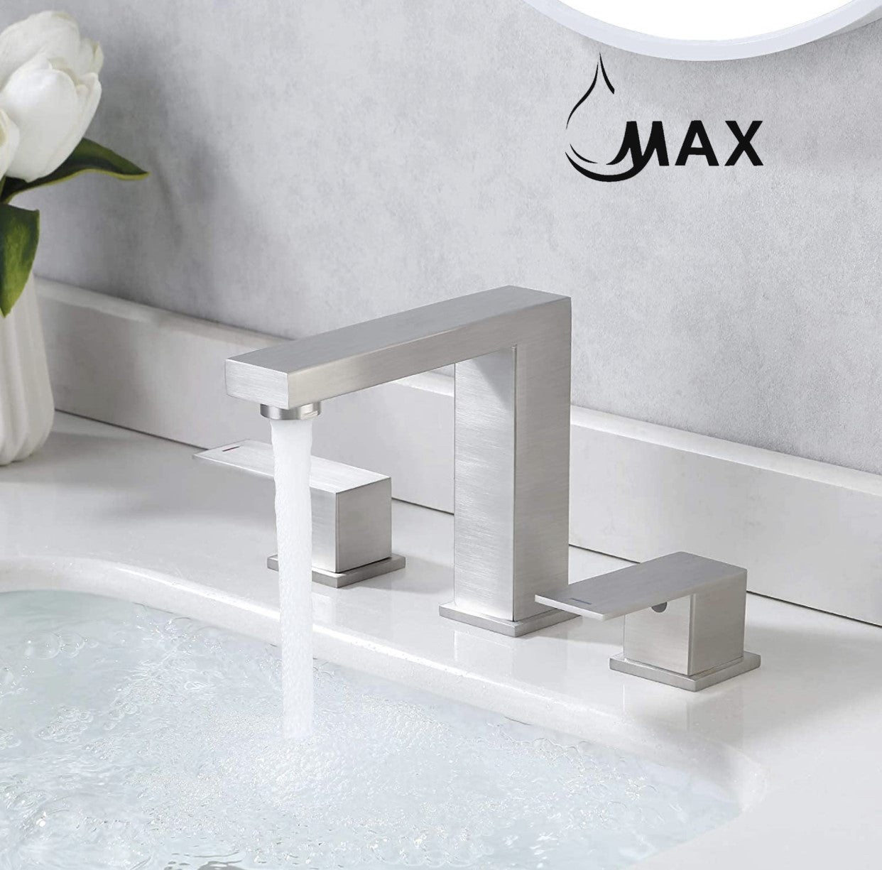 Modern silver faucet on a bathroom counter with 'MAX' branding.
