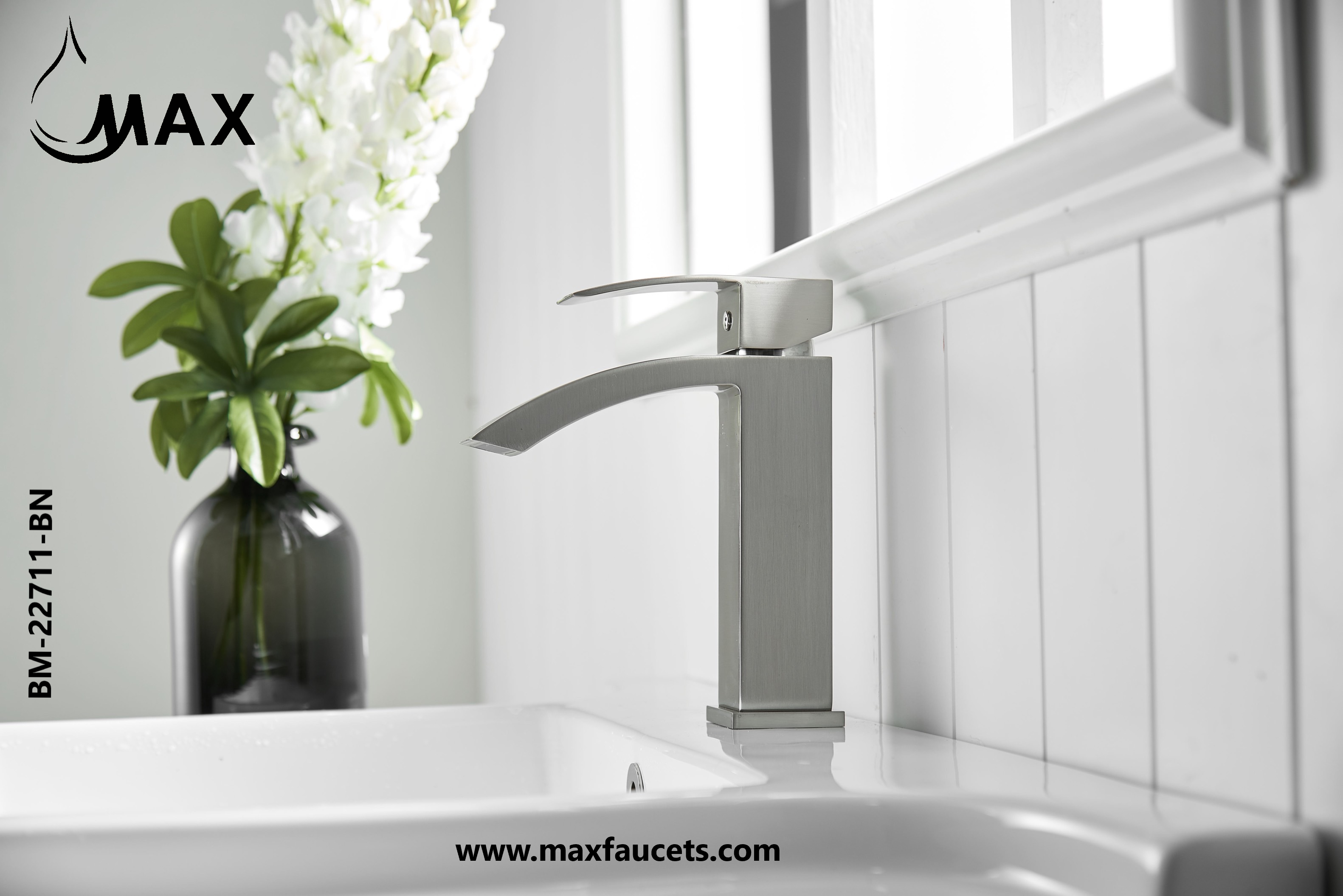MAX Faucets brushed nickel waterfall bathroom faucet installed in a modern bathroom