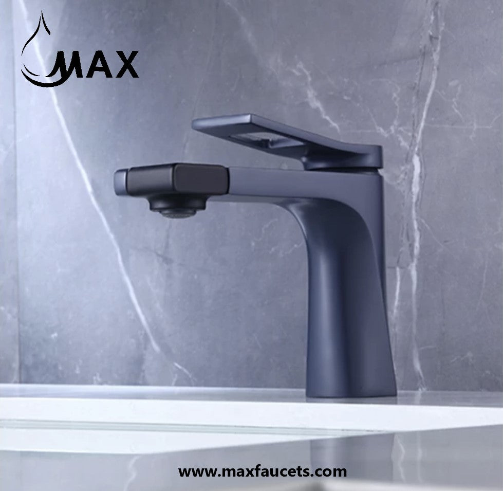 Black faucet on a marble countertop with 'MAX' branding.