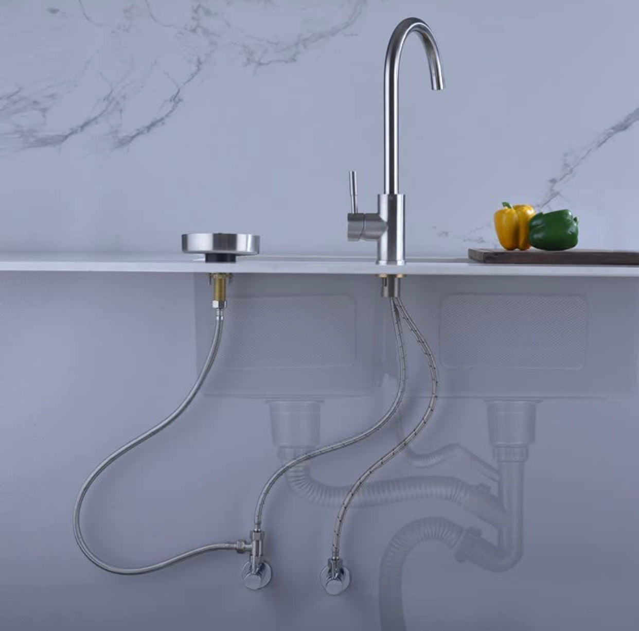 Chrome metal glass rinser installed beside a kitchen faucet
