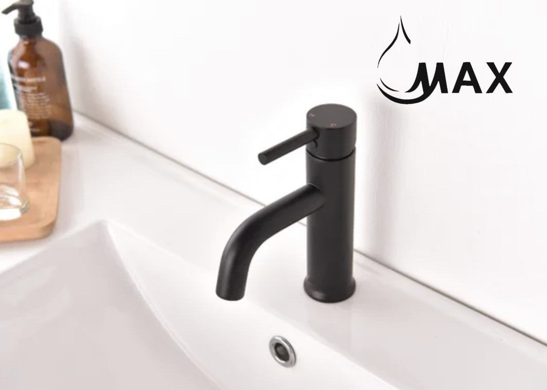 Black faucet with water flowing on a kitchen counter, featuring the MAX brand logo.