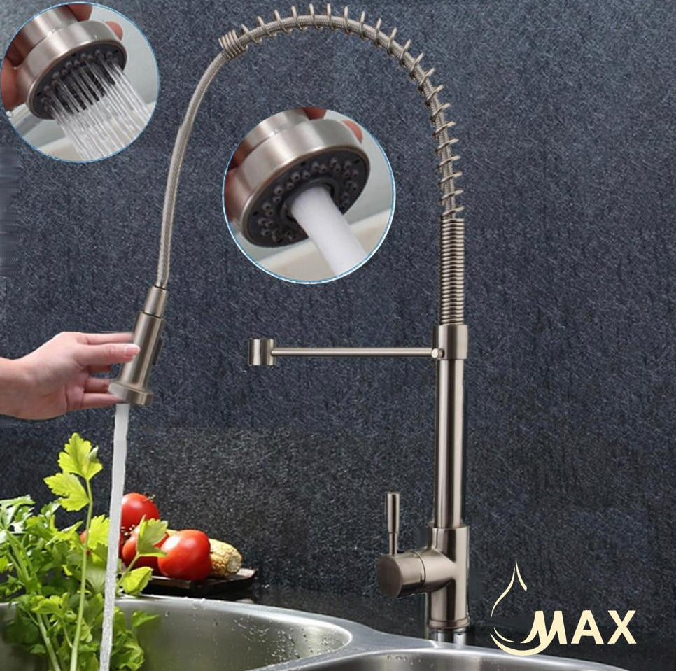Modern kitchen faucet with a person washing vegetables in a sink, featuring the brand 'MAX'.